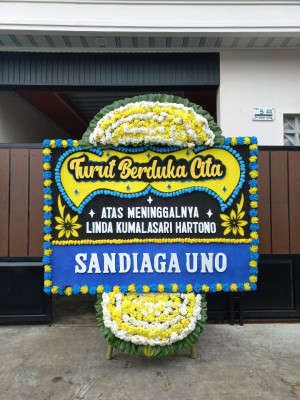 Papan Bunga Duka di Sambutan
